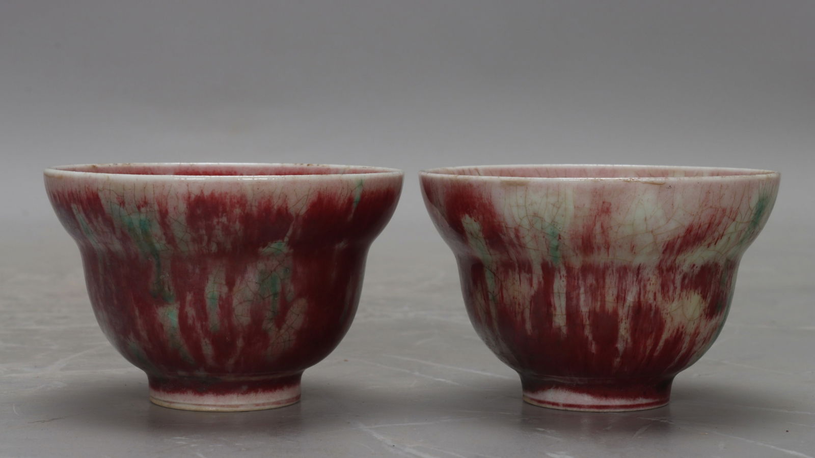 A Pair of Chinese Peach-Bloom Glazed Porcelain Cups: Ht. 5cm, Wd. 7.7cm, Diam. 3cm