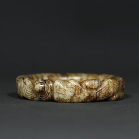 A Chinese Carved Jade Dragon Bangle