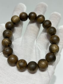 A Chinese Carved Agar-Wood Bracelet