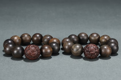 A Pair of Chinese Carved Agar-Wood Bracelets