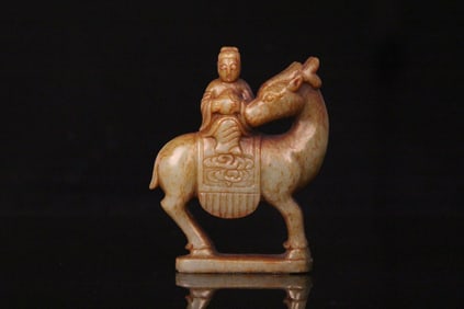 A Chinese Carved Jade Foo-Dog with Rider Statuette