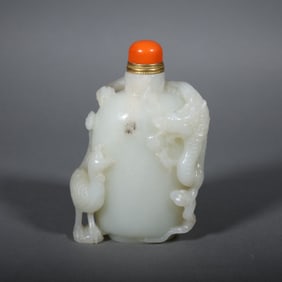 A Chinese Carved Jade Dragon and Phenix Snuff Bottle