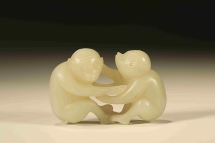A Chinese Carved Jade Monkeys Statuette