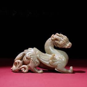 A Chinese Carved Jade Foo-Dog Statuette