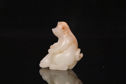 A Chinese Carved Jade Monkey Statuette