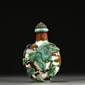 A Chinese Carved Peking Glass Snuff Bottle