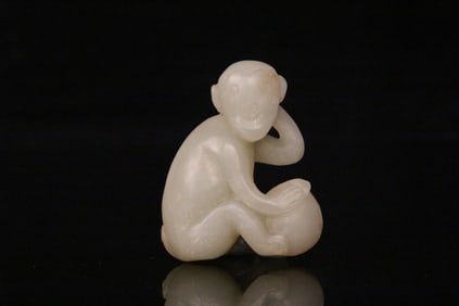 A Chinese Carved Jade Monkey Statuette