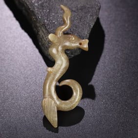 A Chinese Carved Jade Dragon Statuette