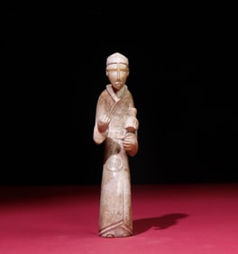 A Chinese Carved Jade Figure of Bird Trainer