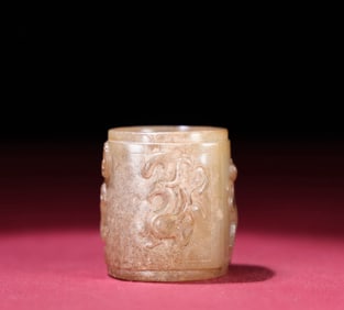 A Chinese Carved Jade Foo-Dog Cong