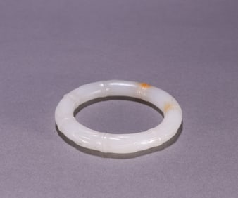 A Chinese Carved Jade Bangle
