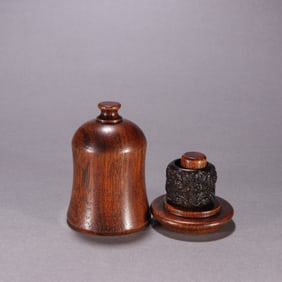 A Chinese Carved Agar-Wood Ring with Case