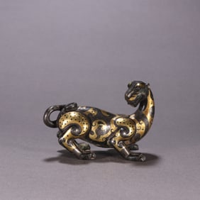 A Chinese Gilt Bronze Foo-Dog Statuette