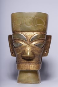 A Chinese Carved Jade Head with Gold Inlaid