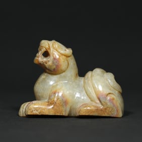 A Chinese Carved Jade Foo-Dog Statuette
