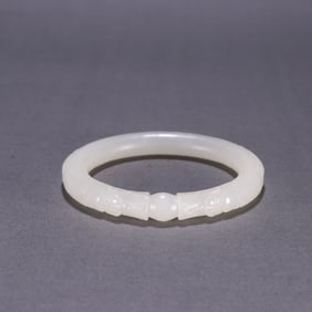 A Chinese Carved Jade Bangle