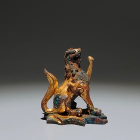 A Chinese Gilt Bronze Foo-Dog Statuette