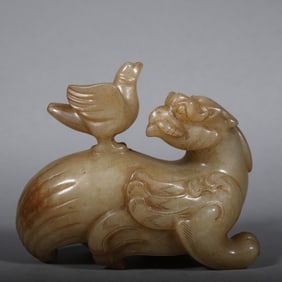A Chinese Carved Jade Foo-Dog Statuette