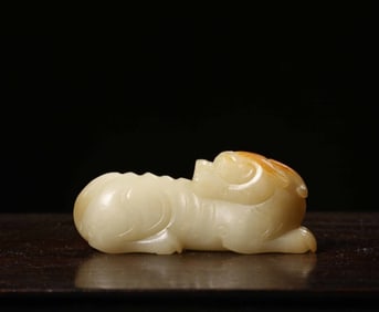 A Chinese Carved Jade Foo-Dog Statuette