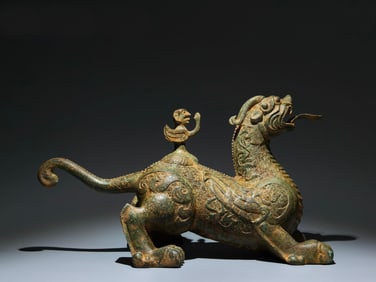 A Chinese Bronze Foo-Dog with Rider