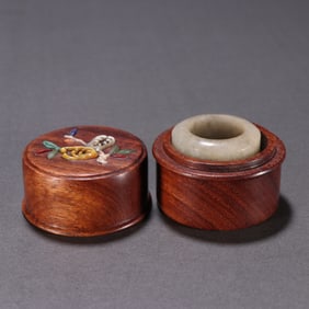 A Chinese Carved Jadeite Ring with Case