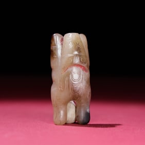 A Chinese Carved Jade Bull Statuette