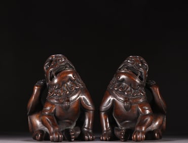 A Pair of Chinese Carved Agar-Wood Foo-Dog Statuettes