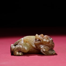 A Chinese Carved Jade Foo-Dog Statuette