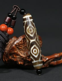 A Chinese Carved Agate DZI Bead