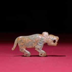 A Chinese Carved Jade Tiger Pendant