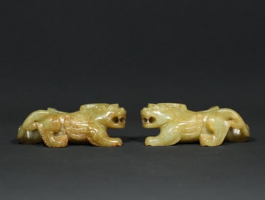 A Pair of Chinese Carved Jade Foo-Dog Statuettes