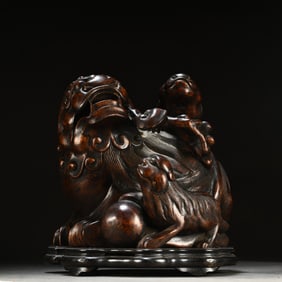 A Chinese Carved Hardwood Foo-Dog Incense Burner