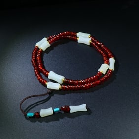 A Chinese Carved Jade and Agate Necklace
