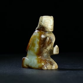A Chinese Carved Jade Figure of Kneeling Man