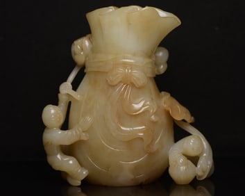 A Chinese Carved Jade Burden and Boys Vase