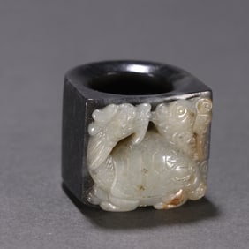 A Chinese Carved Jade Foo-Dog Ring