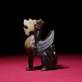 A Chinese Carved Jade Foo-Dog Statuette