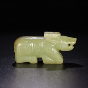 A Chinese Carved Jade Bull Statuette