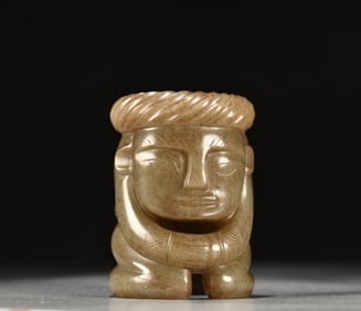 A Chinese Carved Jade Figure of Kneeling Man