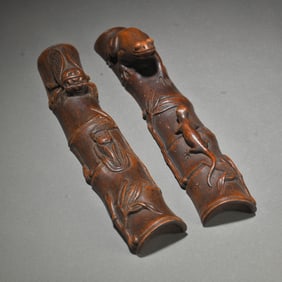 A Pair of Chinese Carved Agar-Wood Paper Weights