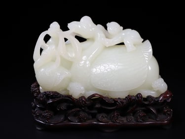 A Chinese Carved Jade Gooses and Boy Statuette