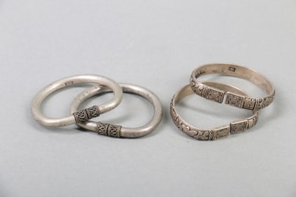 Two Pair of Chinese Carved Silver Bracelets
