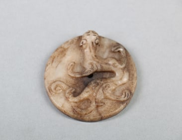 A Chinese Carved Jade Disc