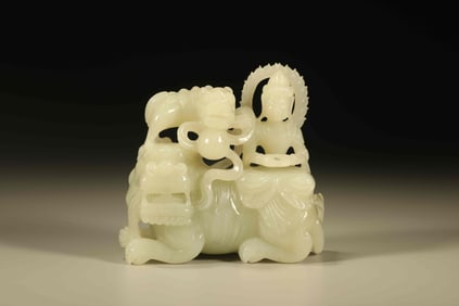 A Chinese Carved Jade Figure of Seated Buddha with Elephant and Foo-Dog Statuette