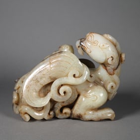 A Chinese Carved Jade Phenix and Foo-Dog Statuette