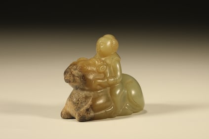 A Chinese Carved Jade Foo-Dog with Rider Statuette