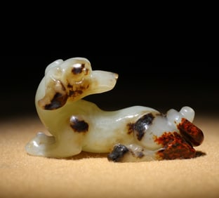 A Chinese Carved Jade Dog Statuette