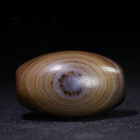 A Chinese Carved Agate DZI Bead