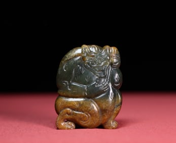 A Chinese Carved Jade Bear Pendant