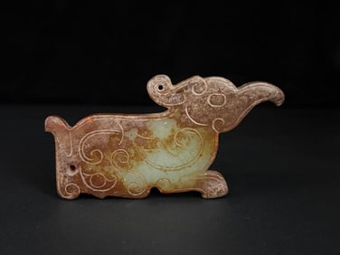A Chinese Carved Jade Foo-Dog Pendant